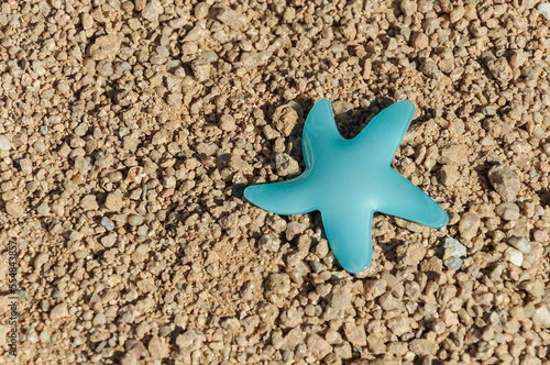 Joyful plastic asterisk on the beach Red Sea.