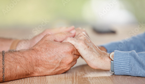 Senior couple holding hands for love, support and trust in retirement, counseling and marriage. Closeup elderly old people, hand holding and hope, empathy or respect, kindness and gratitude with care