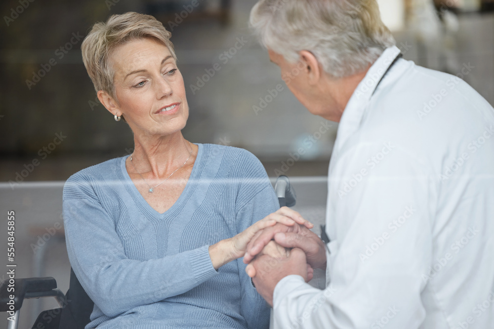 Fototapeta premium Disability patient, holding hands and doctor with help, support and trust in physical therapy, healthcare and therapy service. Medical worker, empathy hand holding and consulting woman in wheelchair