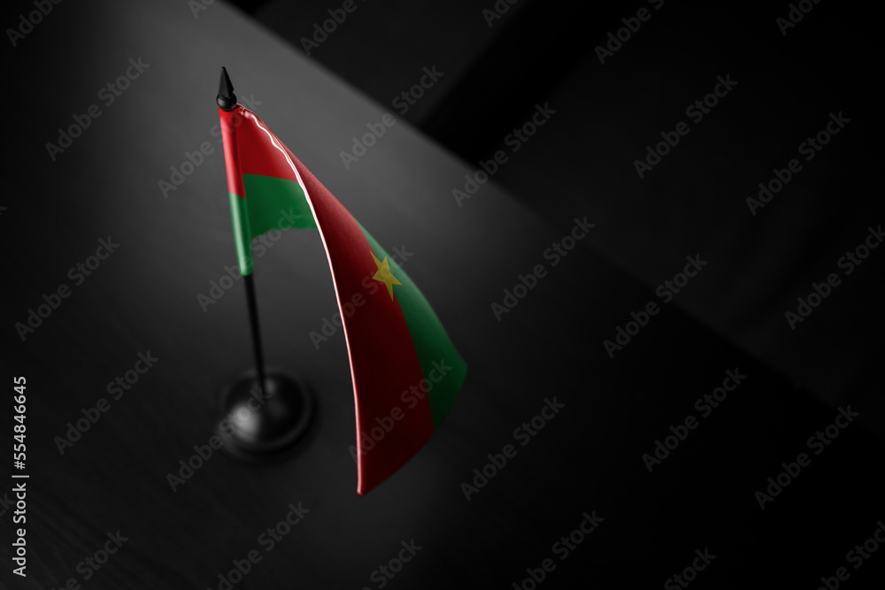 Small national flag of the Burkina Faso on a black background Stock Photo