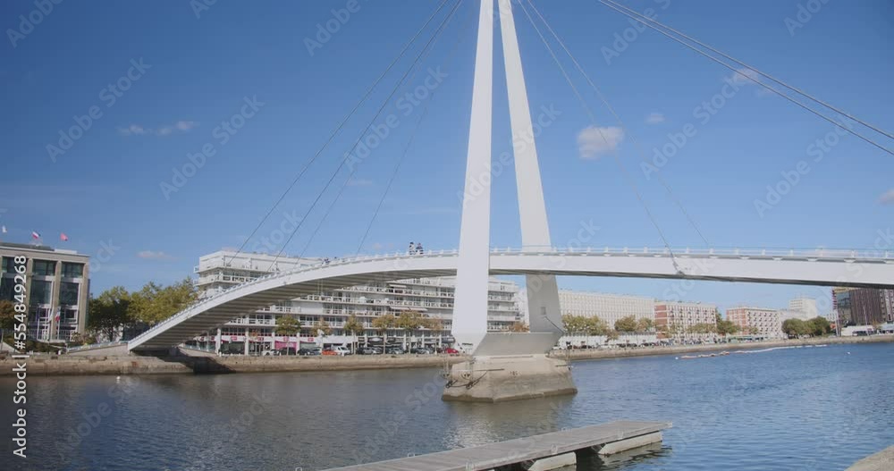 Francois le Chevalier Footbridge Spanning Across Bassin du Commerce Against Blue Sky In Le Havre, France. lateral view Francois le Chevalier Footbridge Spanning Across Bassin du Commerce Against Blue Sky In Le Havre, France. lateral view
