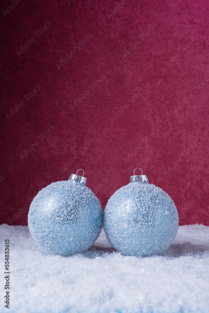 Christmas balls over red stone background with copy space. Christmas and New Year greeting card Christmas balls over red stone background with copy space. Christmas and New Year greeting card