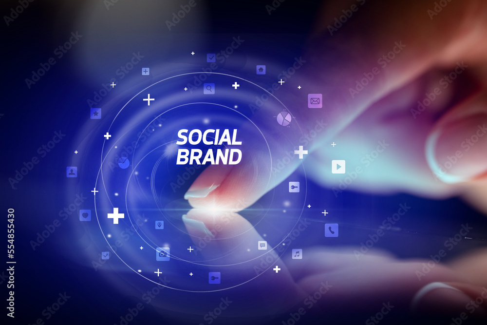Finger touching tablet with social media icons concept Finger touching tablet with social media icons concept