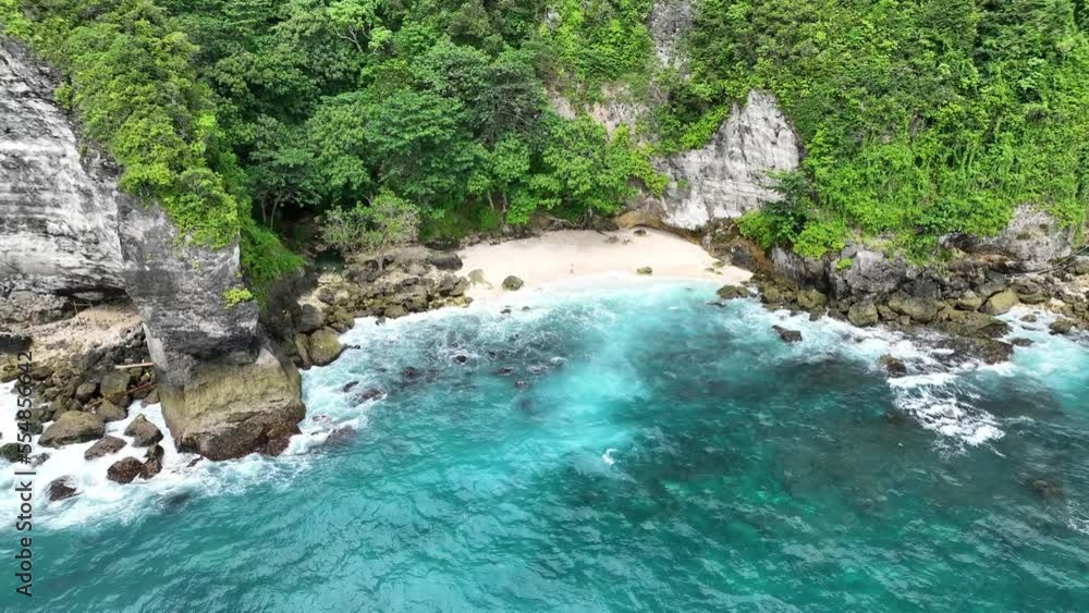 Hidden beach with white sand and turquoise water. Tembeling Beach and Forest - Nusa Penida Island Hidden beach with white sand and turquoise water. Tembeling Beach and Forest - Nusa Penida Island