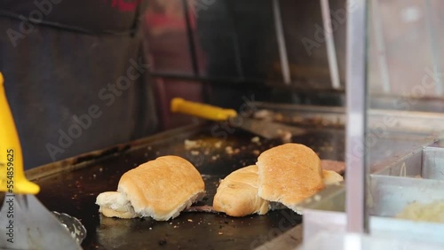 burgers are prepared in outdoors from the buns, cutlets, vegetables and sauce. holiday menu