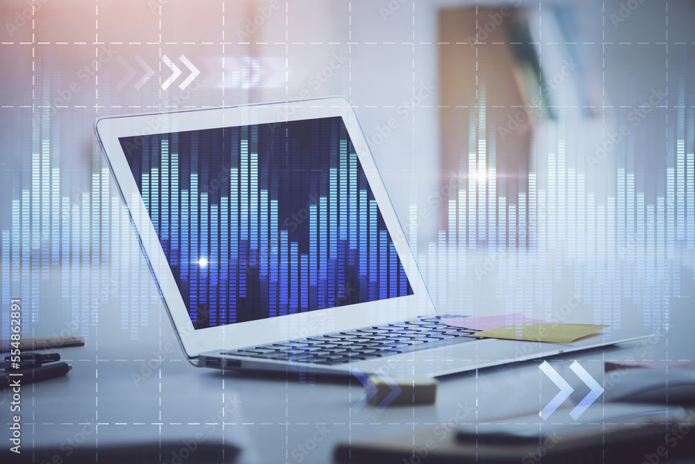 Stock market graph on background with desk and personal computer. Double exposure. Concept of financial analysis. Stock market graph on background with desk and personal computer. Double exposure. Concept of financial analysis.