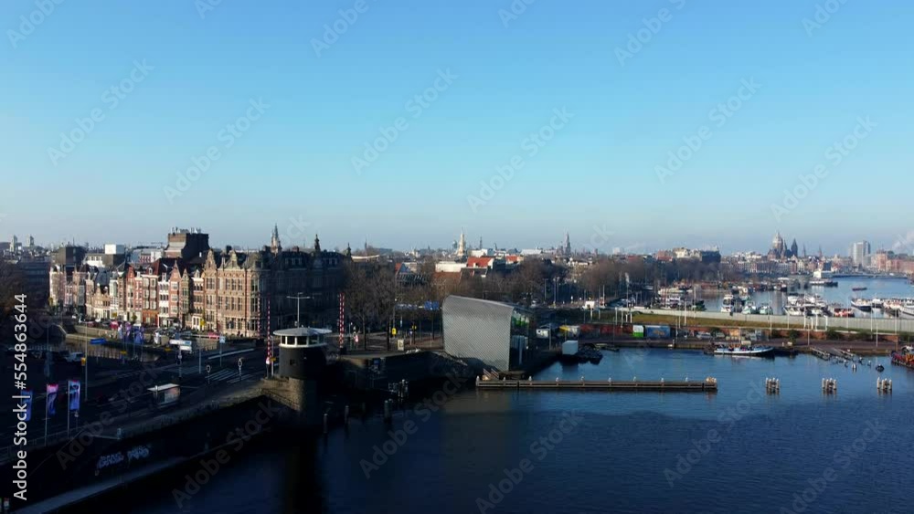 Amsterdam, Netherlands River Boats, Canal in 2022. Drone flight through City Amsterdam, Netherlands River Boats, Canal in 2022. Drone flight through City