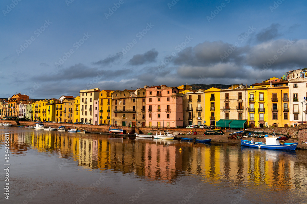 colorful houses and fishing boats on the waterfront of Bosa on the River Terno