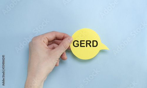 the yellow stacking of white card with Gerd message on vibrant blue background