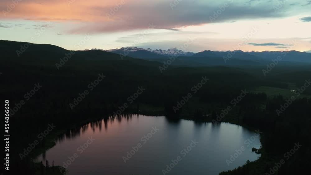 Aerial View Over The Tranquil Waters Of Whitefish Lake At Dusk In Montana, United States - drone shot Aerial View Over The Tranquil Waters Of Whitefish Lake At Dusk In Montana, United States - drone shot