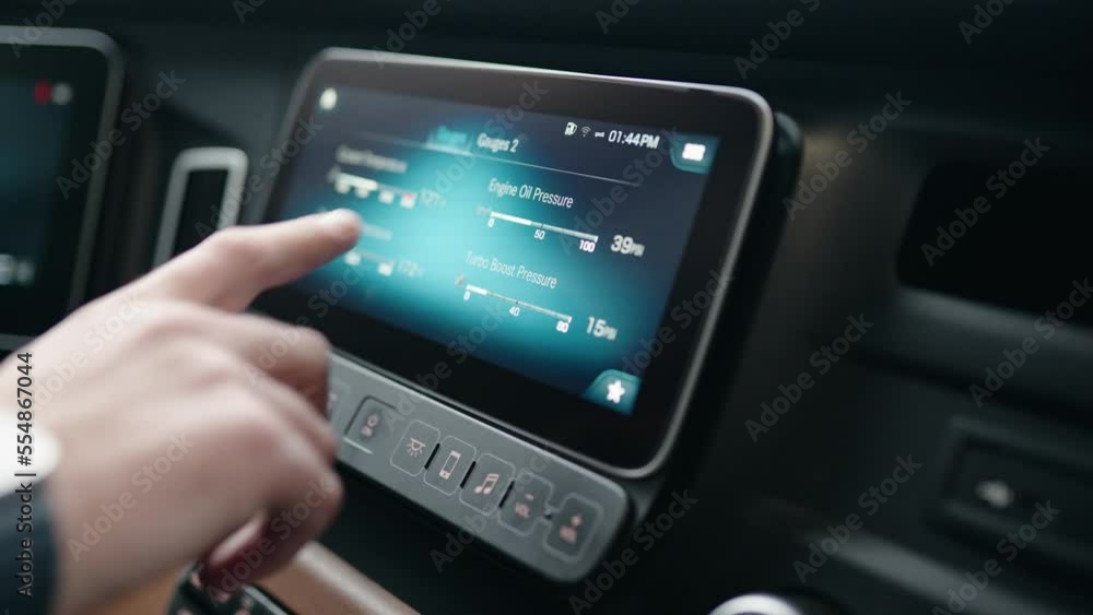 semi truck driver checking gauges and oil life on dasboard screen of a new freightliner cascadia volvo 2023. Inside of a cabin. Tapping with fingers and buttons pressing. semi truck driver checking gauges and oil life on dasboard screen of a new freightliner cascadia volvo 2023. Inside of a cabin. Tapping with fingers and buttons pressing.