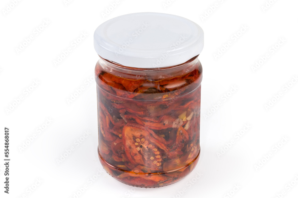 Jar of sun-dried tomatoes in vegetable oil with spices Jar of sun-dried tomatoes in vegetable oil with spices