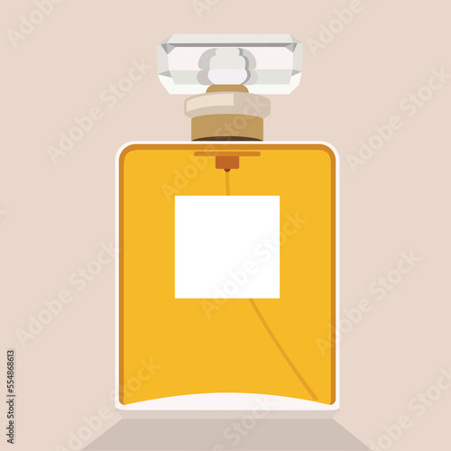 Perfume bottle with orange liquid on pink background