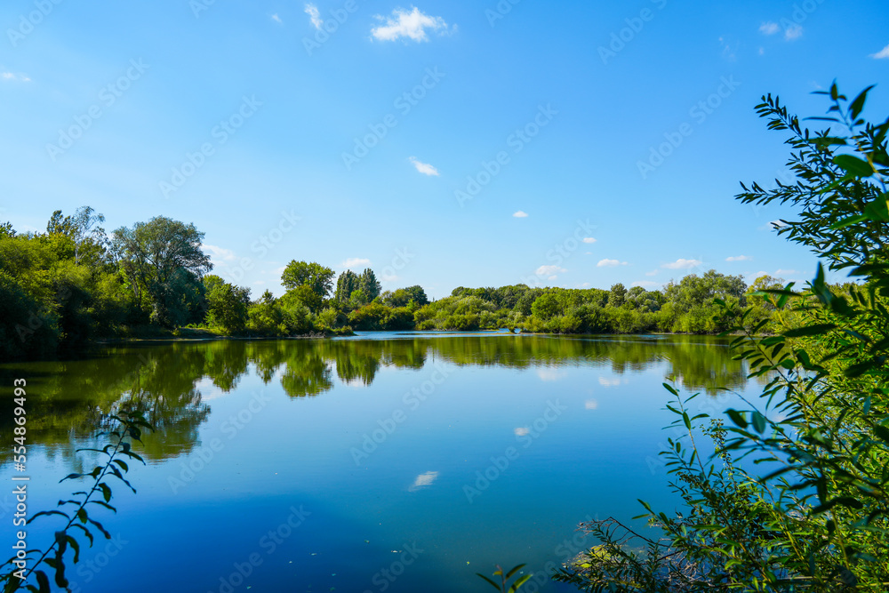 Fototapeta premium Landscape at the Koldinger Seen in the southern Leineaue. Nature reserve near Laatzen. Nature with lakes and green vegetation. 