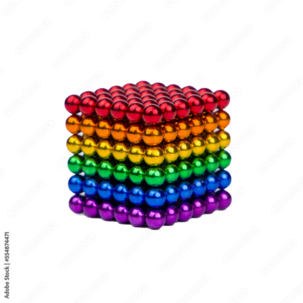 The cube is made of round magnets of different colors. Isolated The cube is made of round magnets of different colors. Isolated