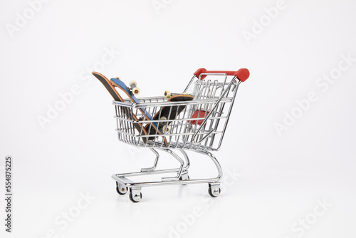 Shopping cart with small toy skateboards inside