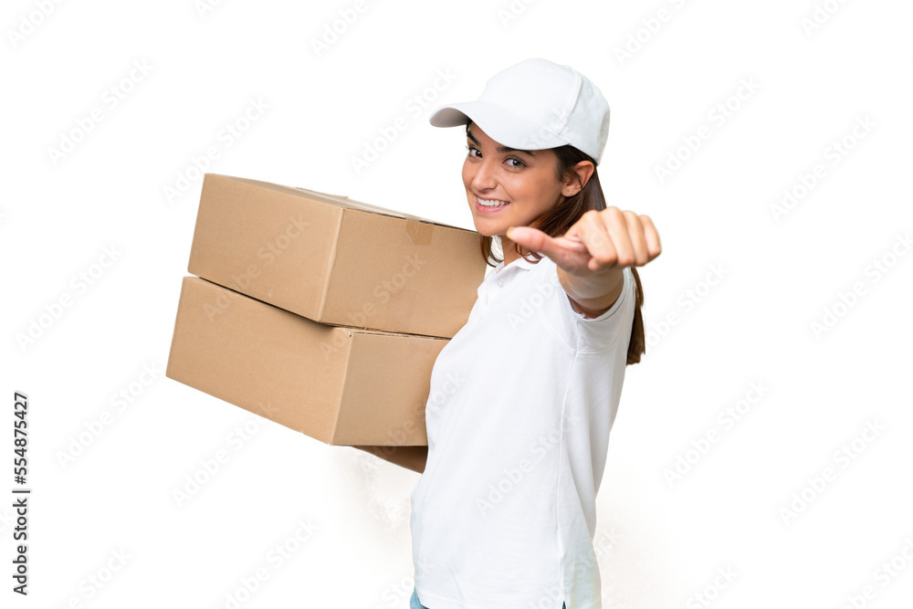 Delivery caucasian woman holding boxes isolated on green chroma background giving a thumbs up gesture Delivery caucasian woman holding boxes isolated on green chroma background giving a thumbs up gesture