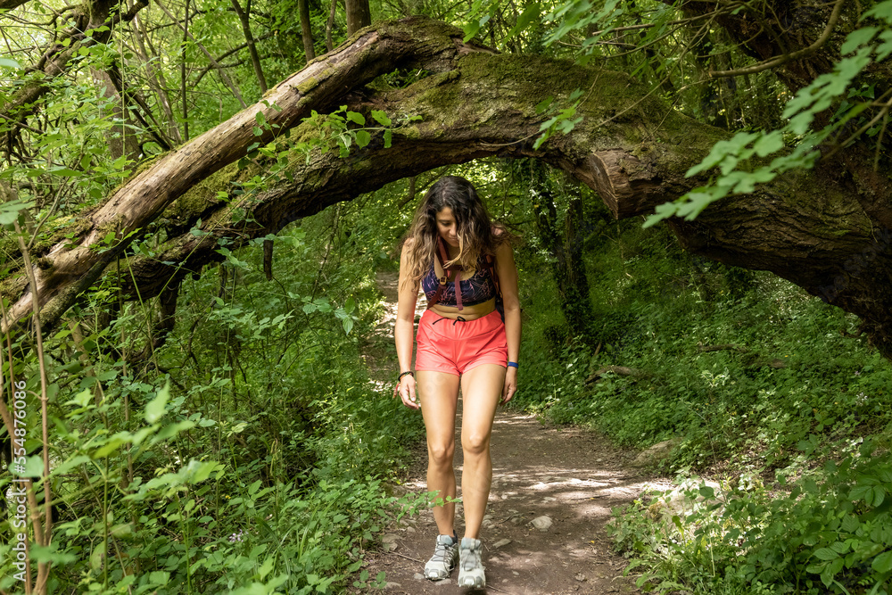 traveling women walking on a path in the woods