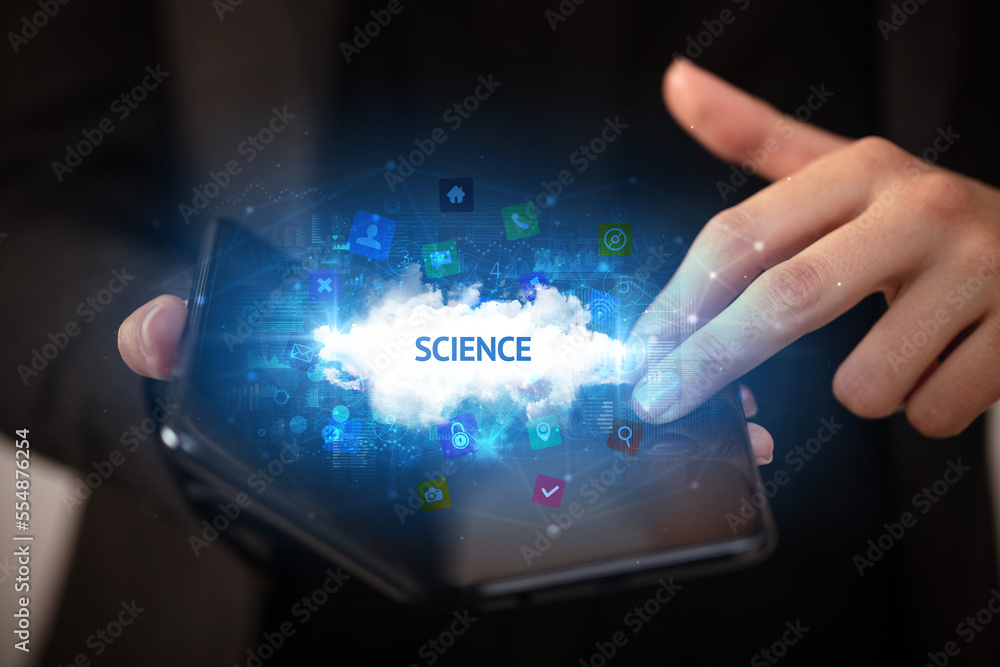 Businessman holding a foldable smartphone, technology concept Businessman holding a foldable smartphone, technology concept