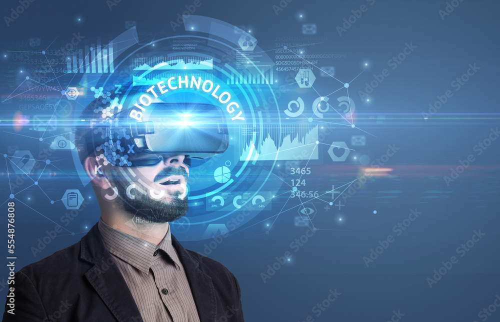 Businessman looking through VR glasses Businessman looking through VR glasses