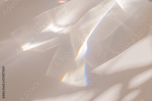 Fotografija Sunlight background, abstract backdrop with light and shadow, glare and shine on paper texture, rainbow flare, beige color trend aesthetic wallpaper