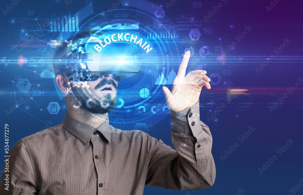 Businessman looking through VR glasses Businessman looking through VR glasses