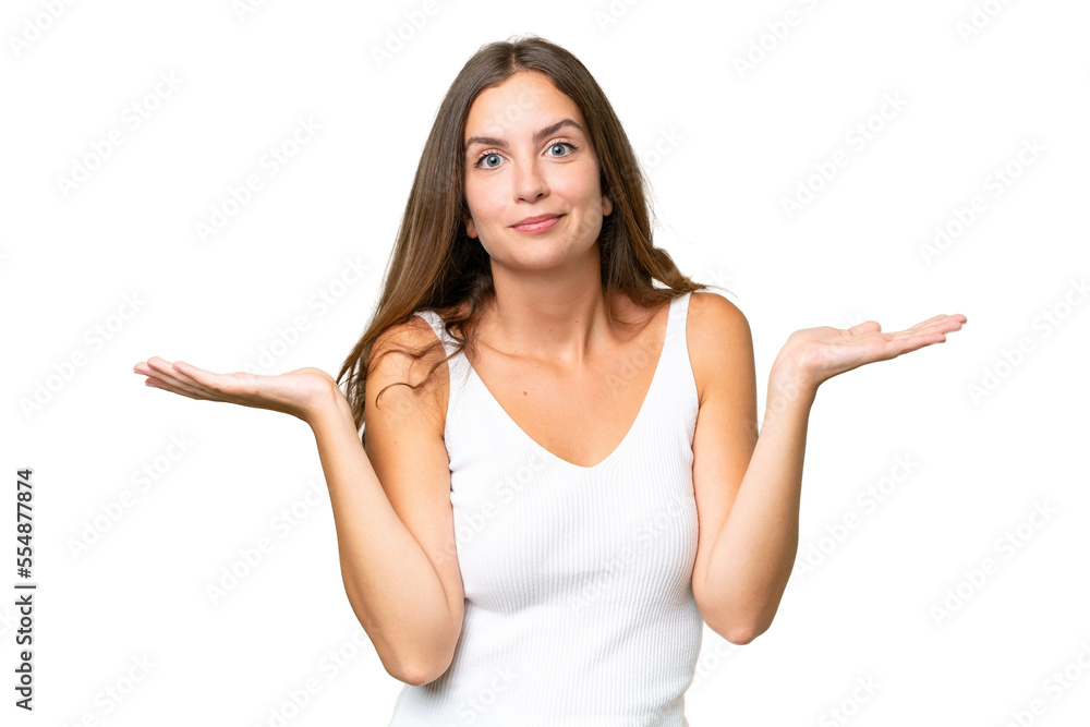 Young pretty woman over isolated background having doubts while raising hands Young pretty woman over isolated background having doubts while raising hands