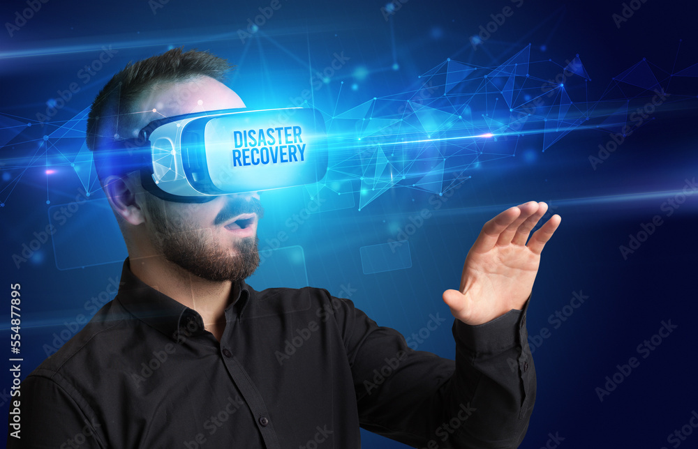 Businessman looking through Virtual Reality glasses, virtual security concept Businessman looking through Virtual Reality glasses, virtual security concept