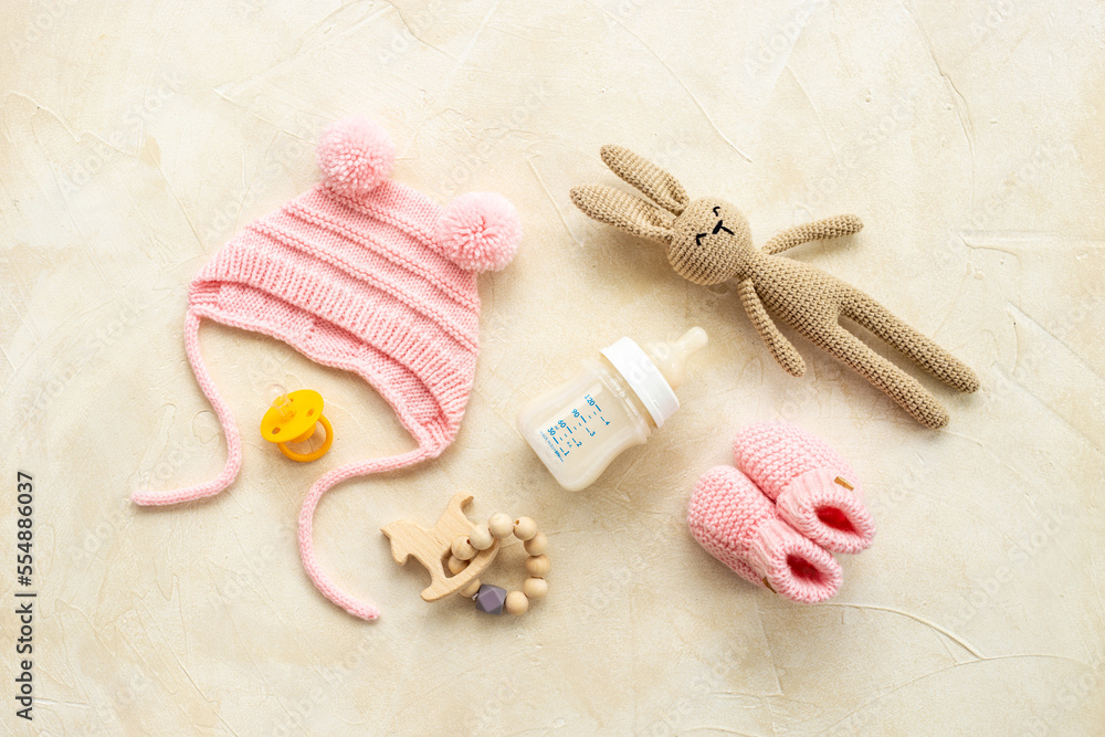 Baby infant hat with booties and kids accessories, flat lay Baby infant hat with booties and kids accessories, flat lay