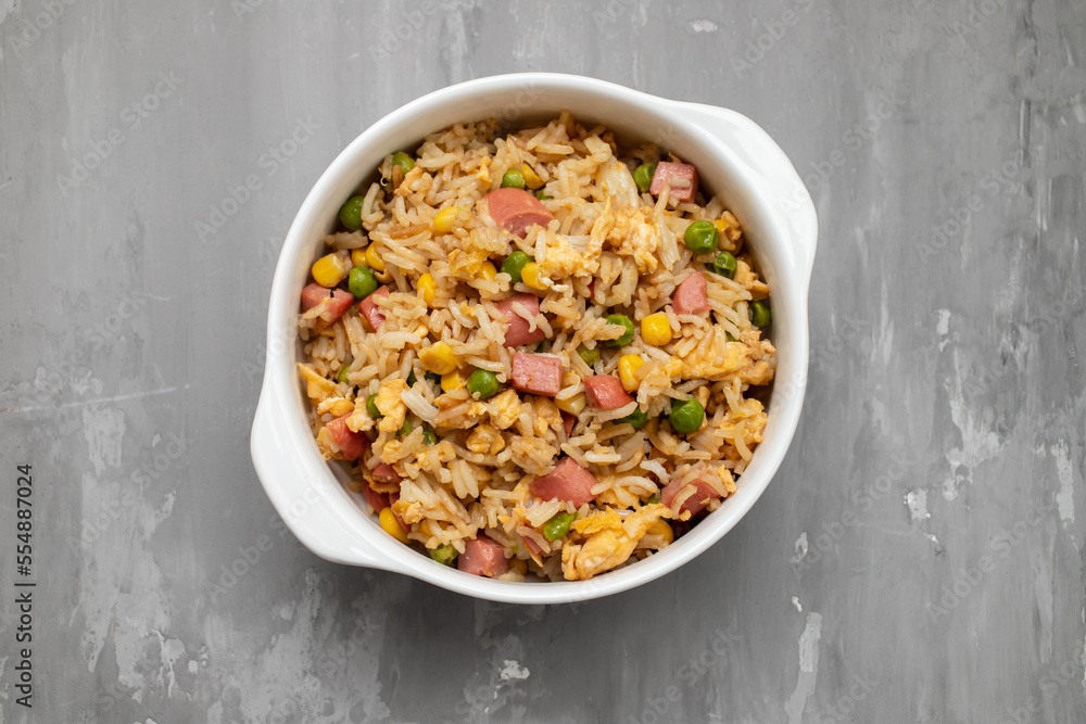 Rice with corn. peas, ham on white bowl Rice with corn. peas, ham on white bowl