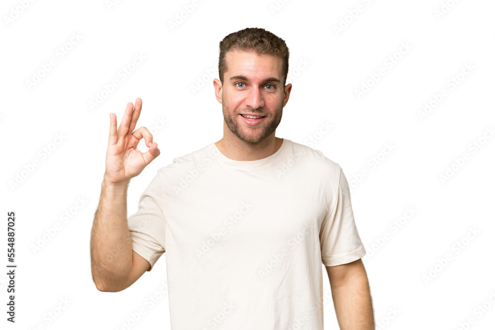Young handsome caucasian man isolated on green chroma background showing ok sign with fingers Young handsome caucasian man isolated on green chroma background showing ok sign with fingers