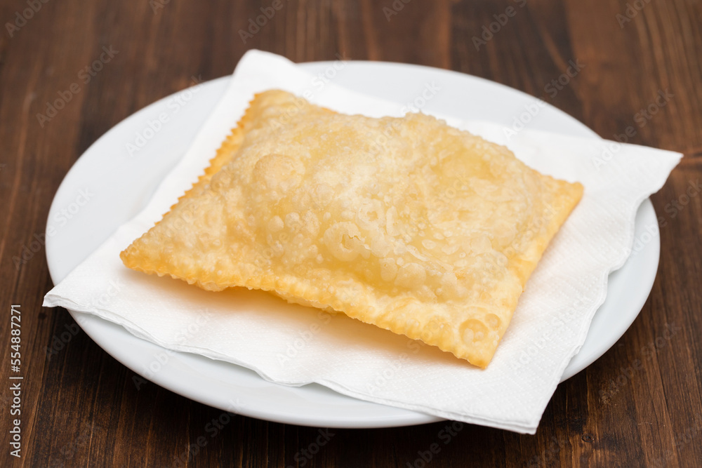 typical brazilian fried pastry on white plate typical brazilian fried pastry on white plate