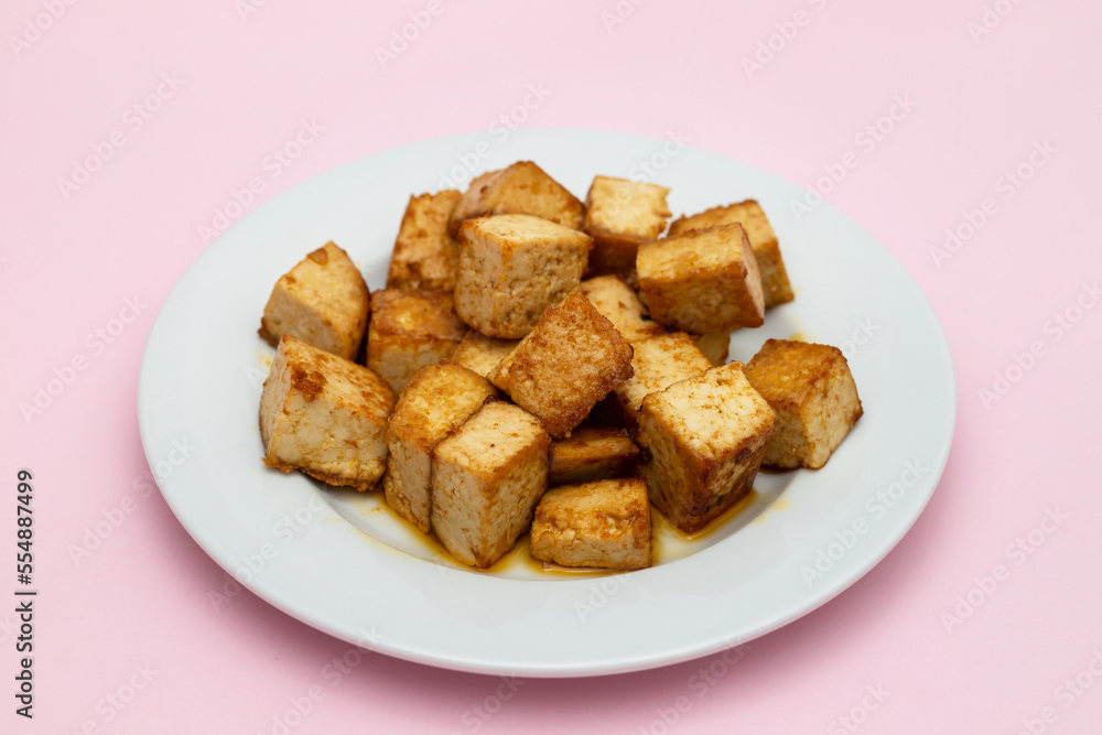 crispy deep stir fried tofu cubes on small dish crispy deep stir fried tofu cubes on small dish
