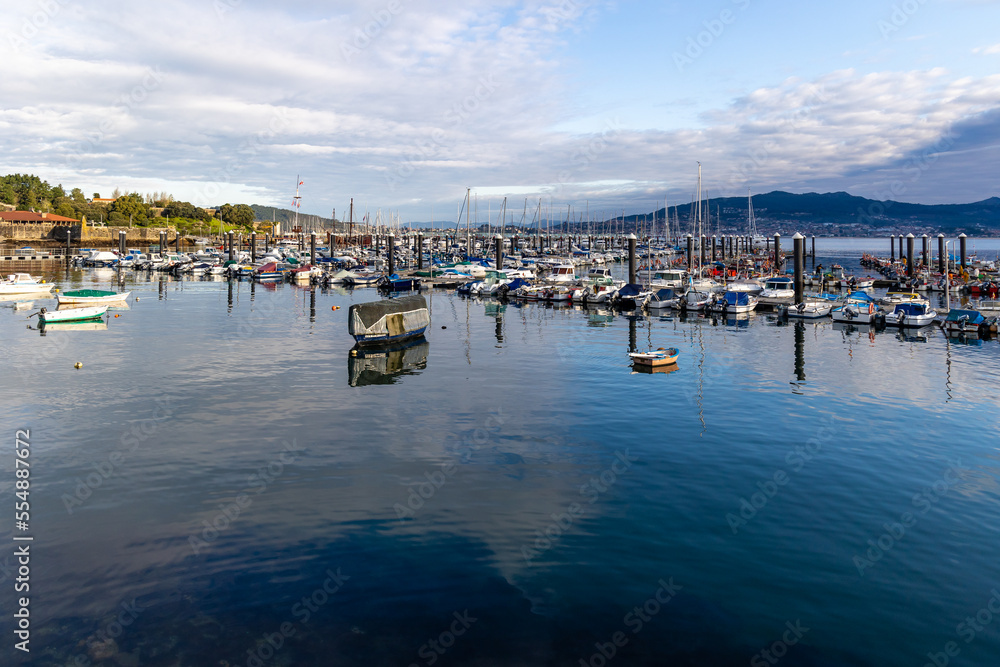 Baiona, Spain - December 05, 2022: views of the boats moored in the port of Baiona, Galicia, Spain