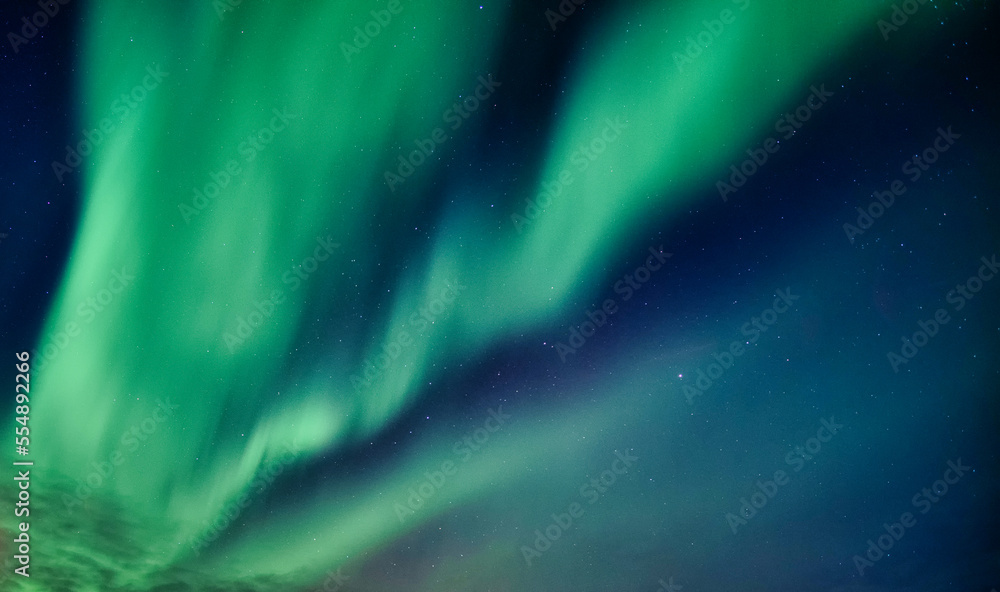 Beautiful Aurora borealis and starry glowing in the night sky on arctic circle