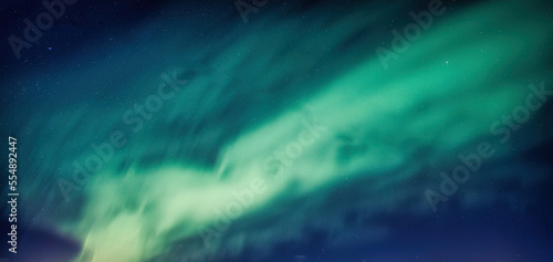 Beautiful Aurora borealis and starry glowing in the night sky on arctic circle