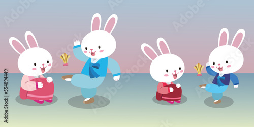 Jegichagi is a traditional Korean game. A white rabbit wearing a hanbok kicks a jegi. © hookeeak