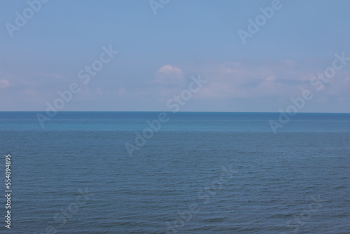 Seascape with blue water and sky on the horizon