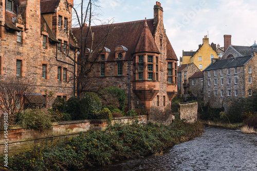 River near aged houses in town photo