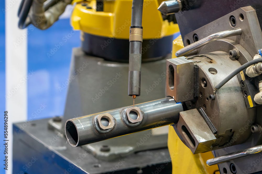 The automatic welding robot working with automotive parts assembly processing. The automatic welding robot working with automotive parts assembly processing.