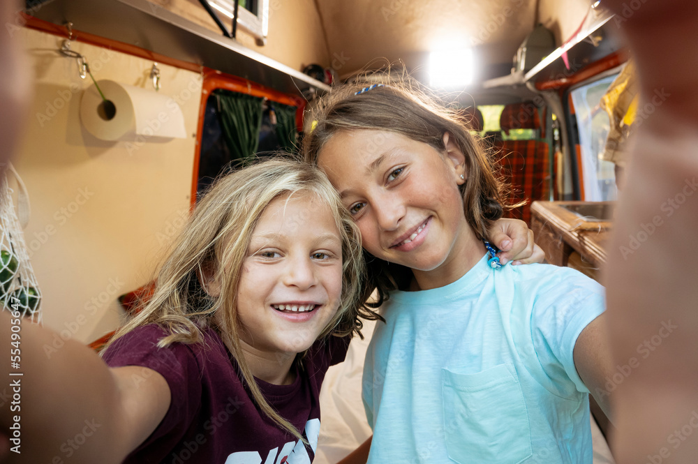 Happy children take a self on a wonderful day at camp. Van life concept. Happy children take a self on a wonderful day at camp. Van life concept.