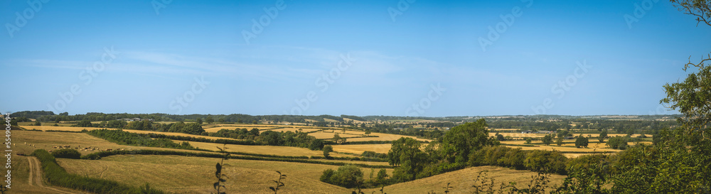 Sprawling farm fields in the English countryside near Arthingworth, Northamptonshire, UK; Northamptonshire, England Sprawling farm fields in the English countryside near Arthingworth, Northamptonshire, UK; Northamptonshire, England