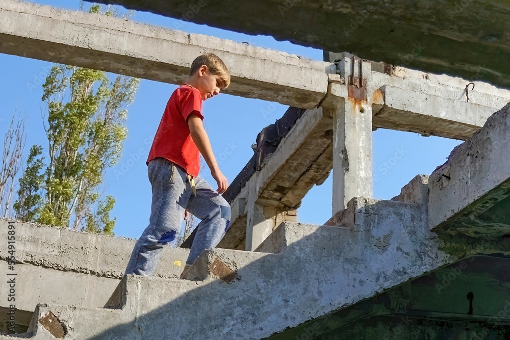 Poor and dirty street children living on an abandoned constructi