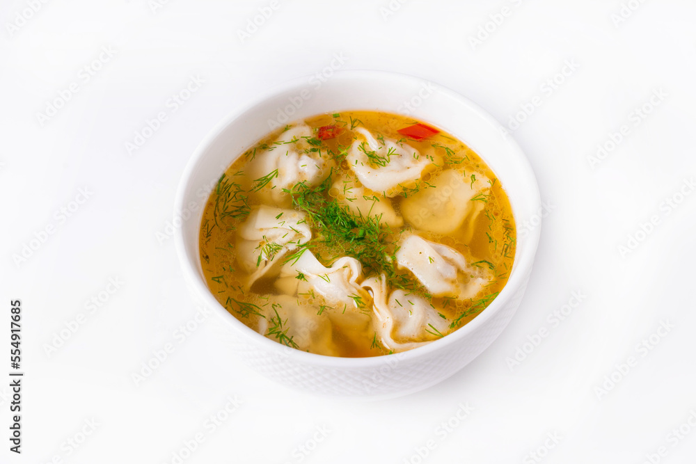 dumplings with broth on a white background