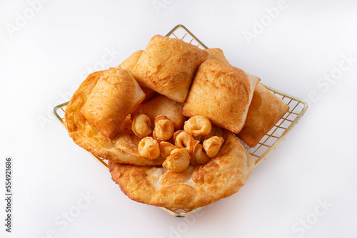 tortillas, baursaks and fried dumplings on a white background photo