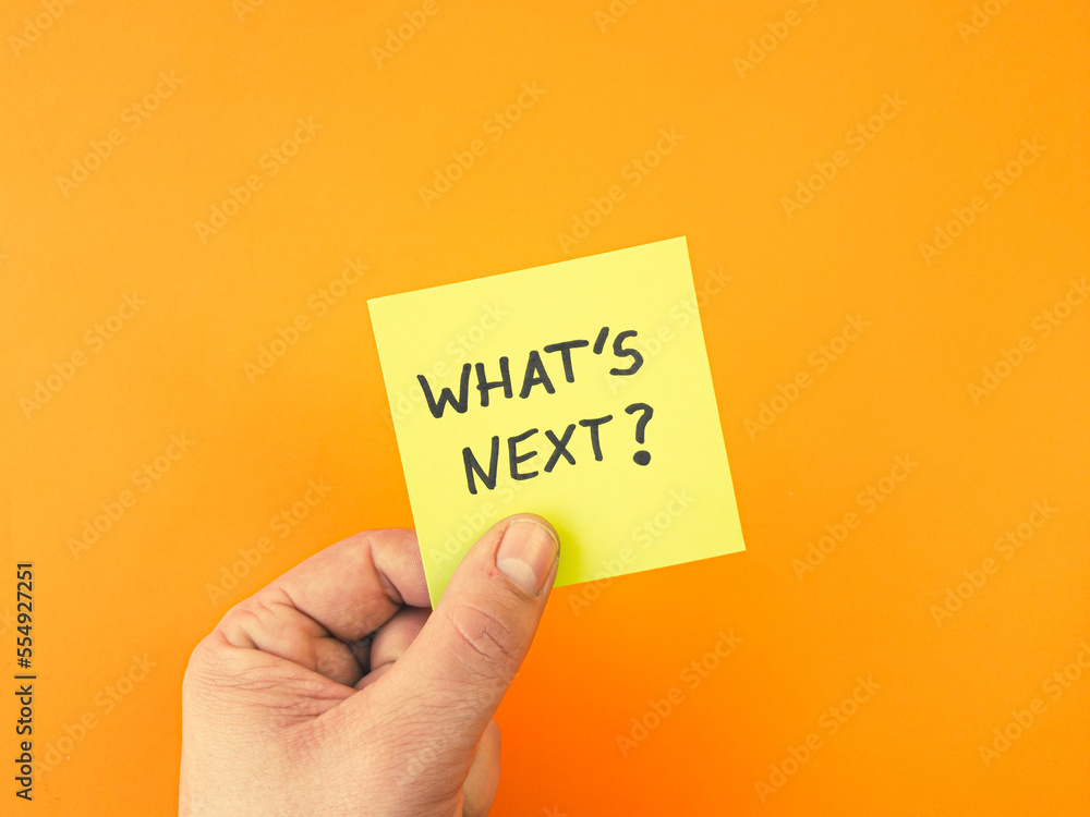 What's next phrase written on sticky note. Business, strategy, plan, progress concept What's next phrase written on sticky note. Business, strategy, plan, progress concept