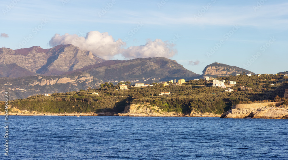 Rocky Coast and Homes near Touristic Town, Sorrento, Italy. Amalfi Coast. Sunny Evening