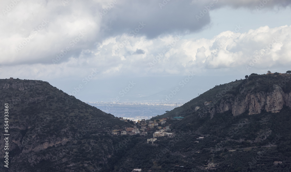Obraz premium Residential Homes on top of Mountain by the Sea. Near Touristic Town of Sorrento, Italy. Cloudy Day.
