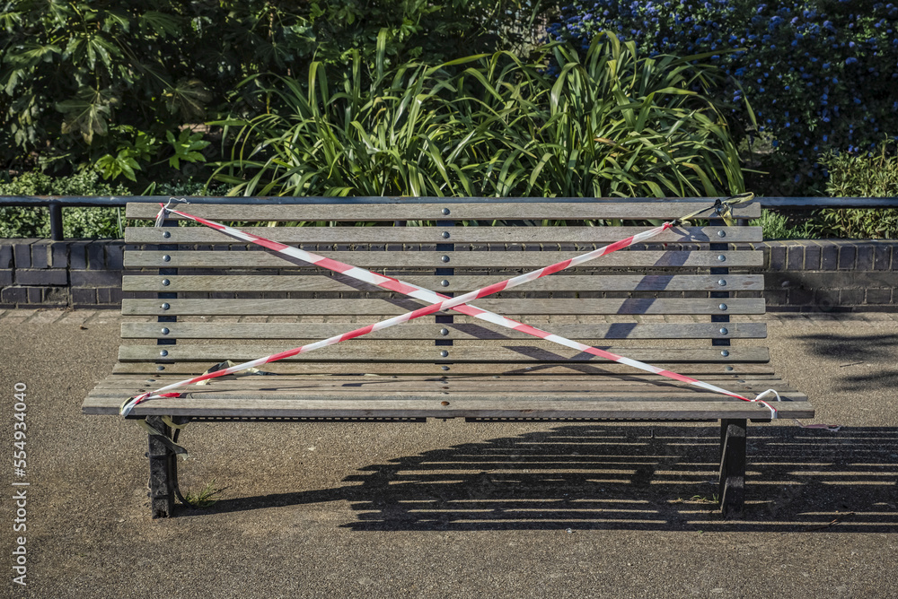 A park bench is roped off during the national lockdown, Covid-19 Global Pandemic; London, England A park bench is roped off during the national lockdown, Covid-19 Global Pandemic; London, England