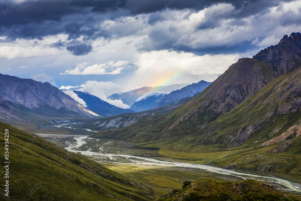 Sunlit rainbow over mountains in the Marsh Fork River Valley, Brooks Range, ANWR, Alaska, USA Sunlit rainbow over mountains in the Marsh Fork River Valley, Brooks Range, ANWR, Alaska, USA